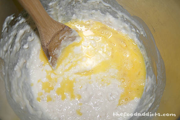 Combine 2 cups of flour along with sugar, instant yeast and salt. Then add melted butter, warm milk, eggs, and vanilla extract. Mix together using an electric mixer.