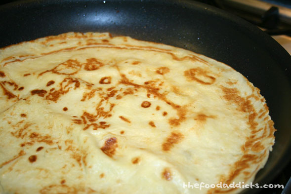 Oil a large skillet over moderate heat and pour a third of the batter into the skillet and swirl the pan to coat it evenly. Cook until lightly golden, then flip the crêpe and cook for about 30 seconds longer. 